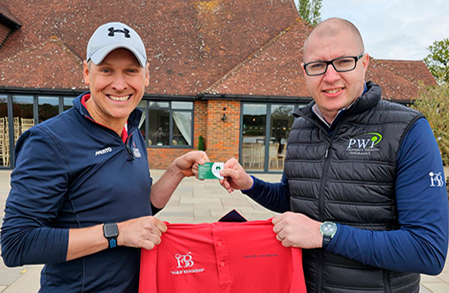 Chris Watts winning at Woking group presented by Toby Pawson (left)